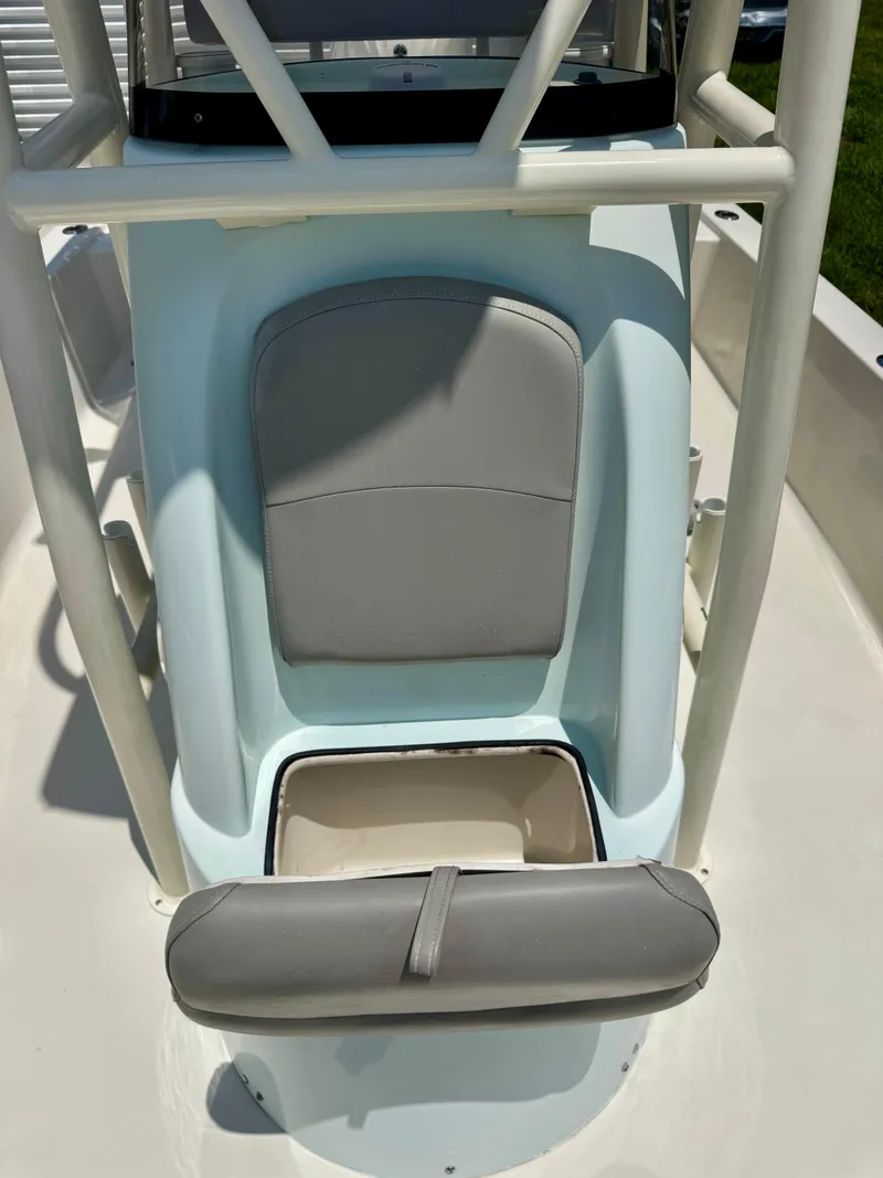 Slide: The Image of 2011 Pathfinder 2400 Tournament Edition boat seat with storage compartment open. - 18