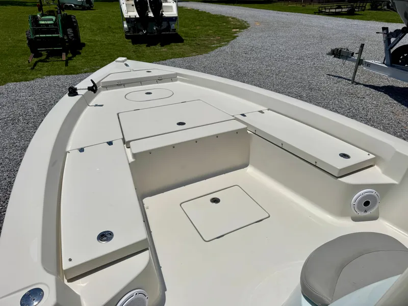 Slide: The Image of 2011 Pathfinder 2400 Tournament Edition boat deck with storage compartments and seating. - 24
