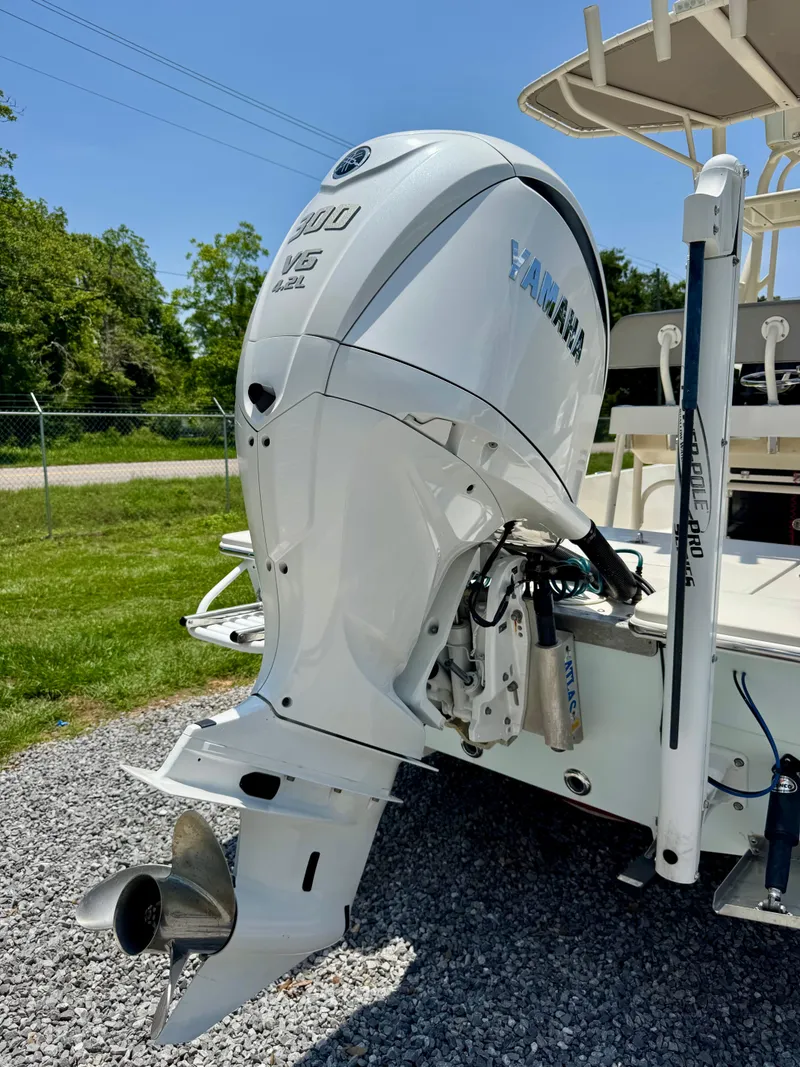 Slide: The Image of 2011 Pathfinder 2400 Tournament Edition boat with Yamaha outboard motor, parked on gravel. - 5