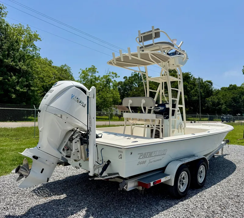 Slide: The Image of 2011 Pathfinder 2400 Tournament Edition boat on trailer, featuring Yamaha outboard motor. - 6