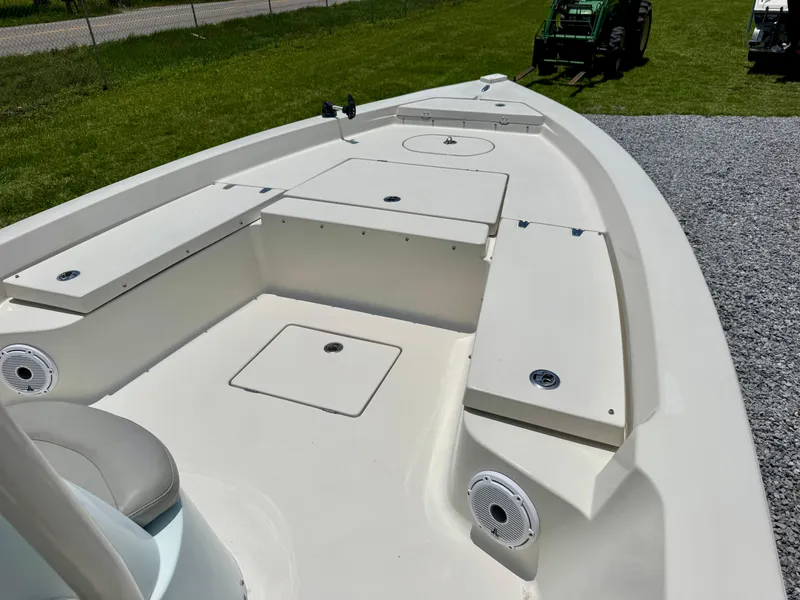 Slide: The Image of 2011 Pathfinder 2400 Tournament Edition boat deck with storage compartments and seating. - 7