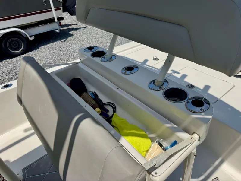 Slide: The Image of 2011 Pathfinder 2400 Tournament Edition boat seat with storage and cup holders. - 8