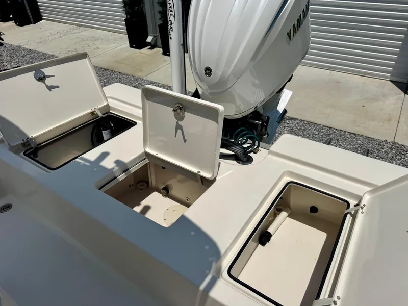 Slide: The Image of 2011 Pathfinder 2400 Tournament Edition boat with open storage compartments and Yamaha outboard motor. - 9