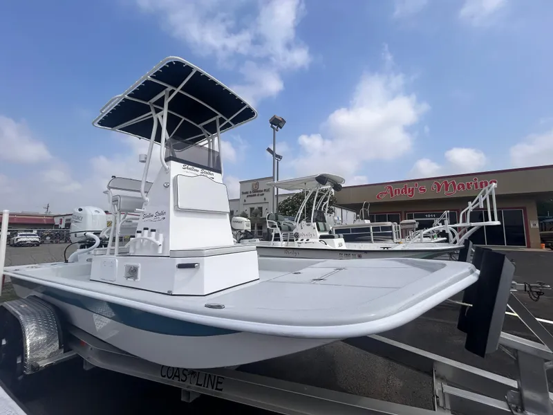 Slide: The Image of 2025 Shallow Stalker CAT211PRO boat on trailer at dealership under cloudy sky. - 8