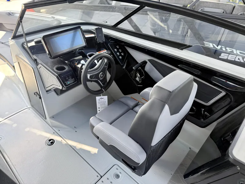 Slide: The Image of 2025 Yamaha Boats 255XD cockpit with modern controls and seating. - 10