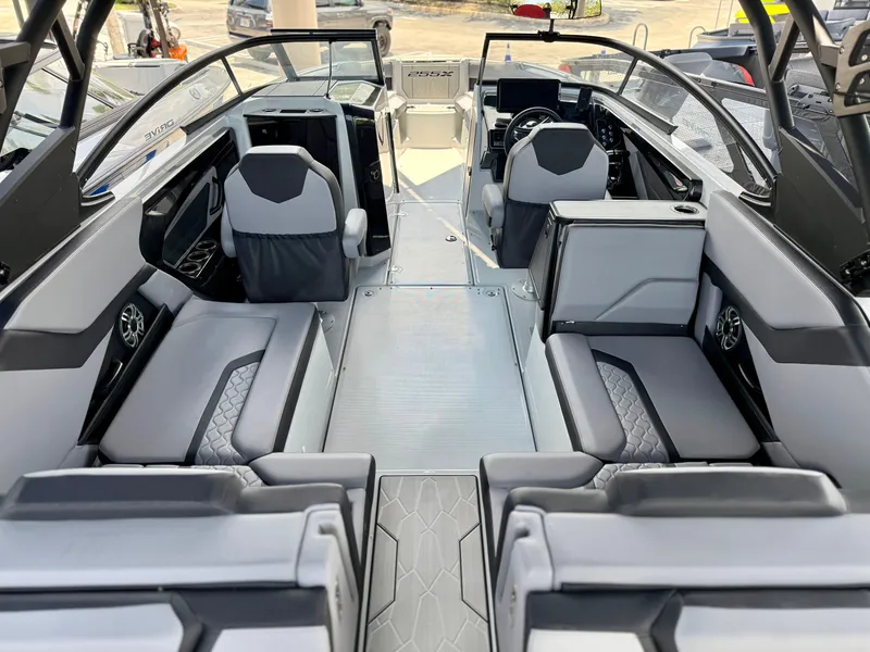 Slide: The Image of 2025 Yamaha Boats 255XD interior, featuring modern seating and sleek design. - 6