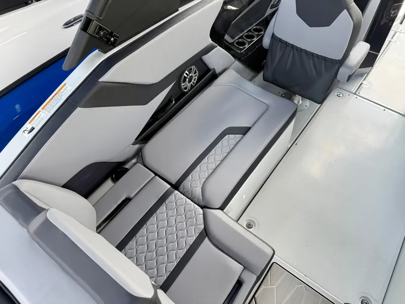 Slide: The Image of 2025 Yamaha Boats 255XD interior with gray seating and modern design. - 8