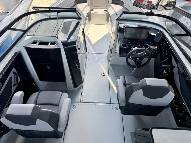 Slide: The Image of 2025 Yamaha Boats 255XD interior with modern dashboard and seating. - 9