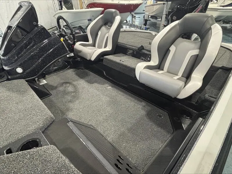 Slide: The Image of 2025 Nitro Z18 boat interior with dual seats and sleek design. - 10