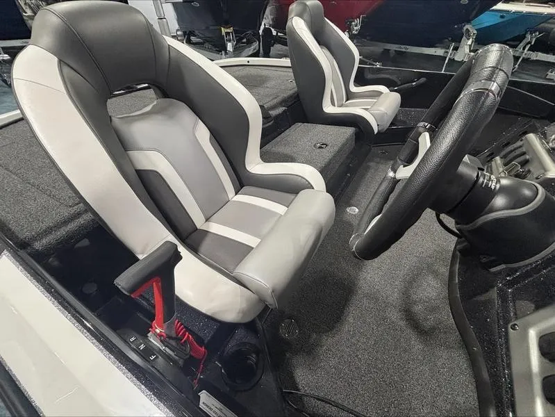 Slide: The Image of 2025 Nitro Z18 boat interior with sleek, modern seats and steering wheel. - 2