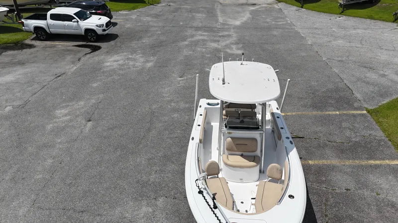 Slide: The Image of 2019 Sportsman Open 212 Center Console boat parked in a lot, aerial view. - 3