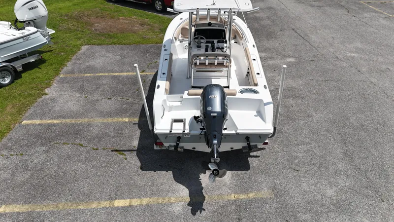 Slide: The Image of 2019 Sportsman Open 212 Center Console boat, aerial view, parked on asphalt. - 4