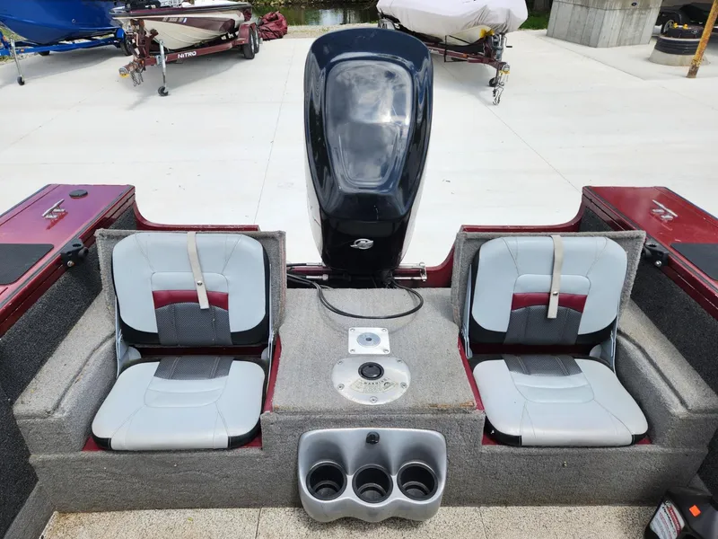 Slide: The Image of 2011 Tracker Targa V-18 Combo boat interior with two seats and motor. - 10