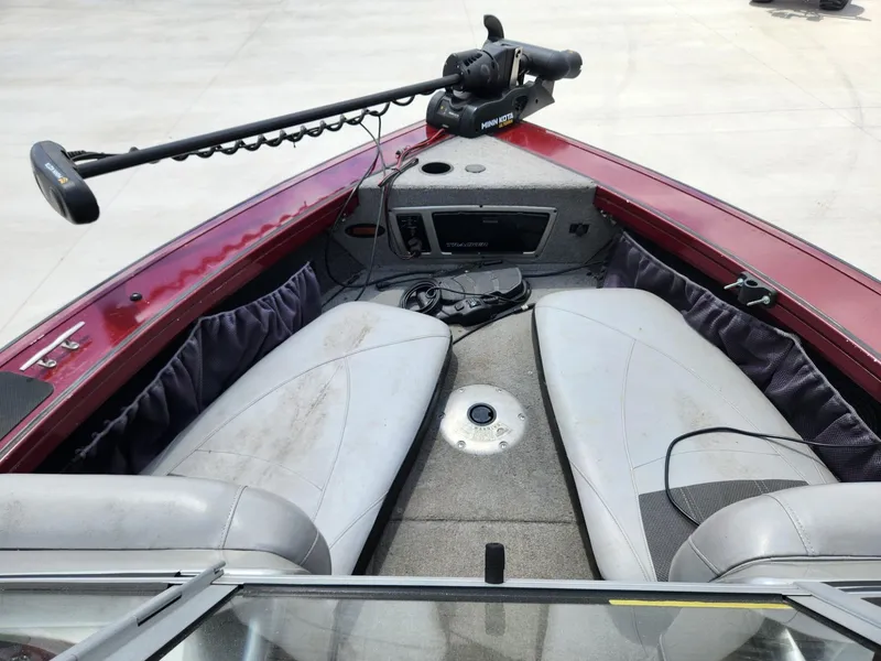 Slide: The Image of 2011 Tracker Targa V-18 Combo boat interior with seating and trolling motor. - 4