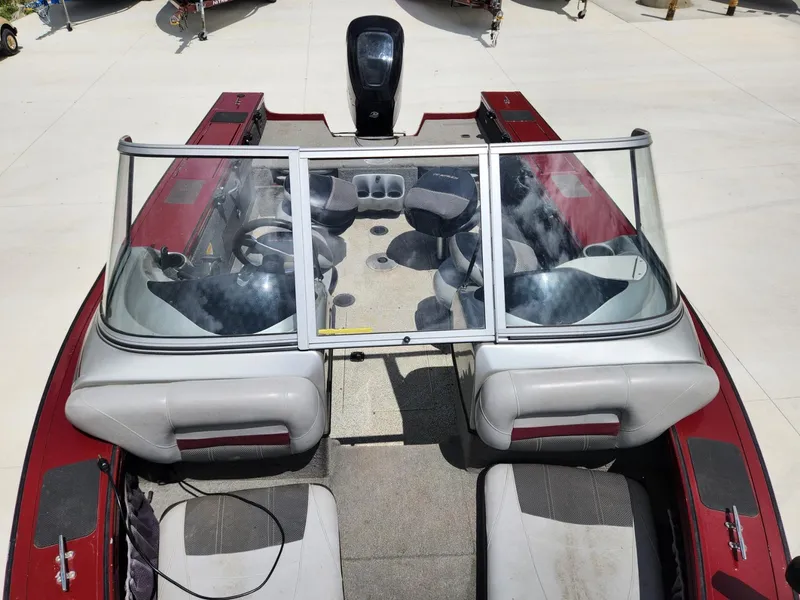 Slide: The Image of 2011 Tracker Targa V-18 Combo boat with red and gray interior, viewed from above. - 5