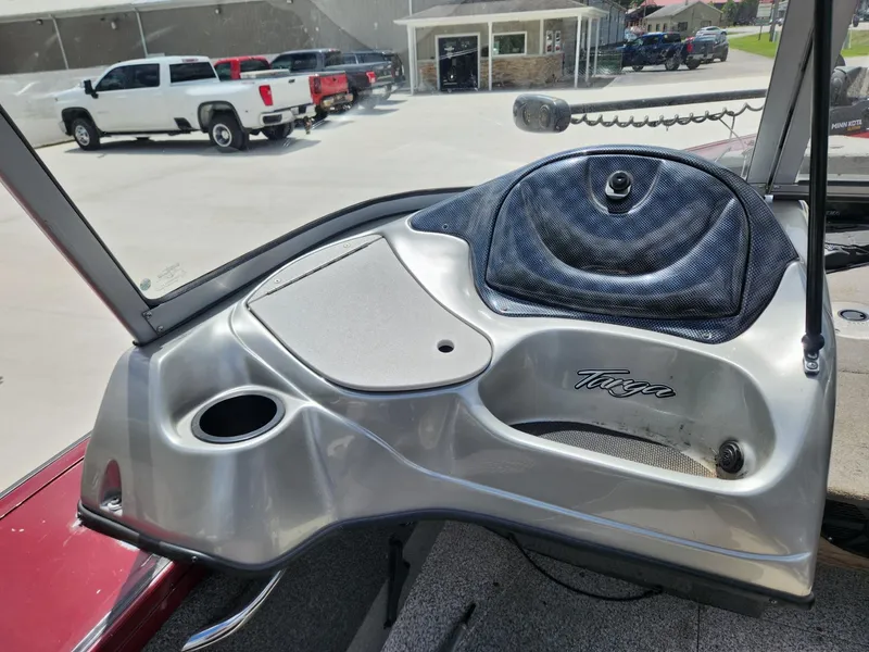 Slide: The Image of 2011 Tracker Targa V-18 Combo boat dashboard with cup holder and storage compartment. - 8