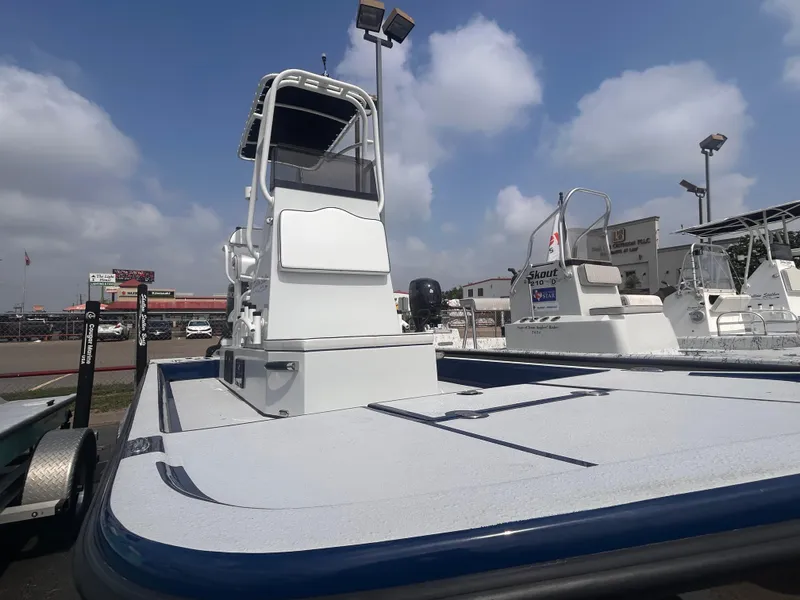 Slide: The Image of 2025 Shallow Stalker CAT211PRO boat on display under a cloudy sky. - 11