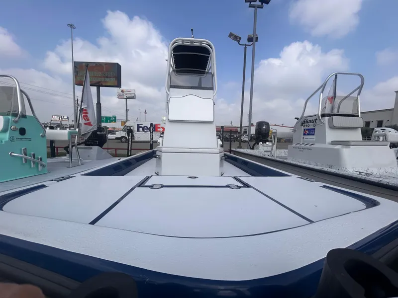 Slide: The Image of 2025 Shallow Stalker CAT211PRO boat displayed outdoors under cloudy sky. - 3