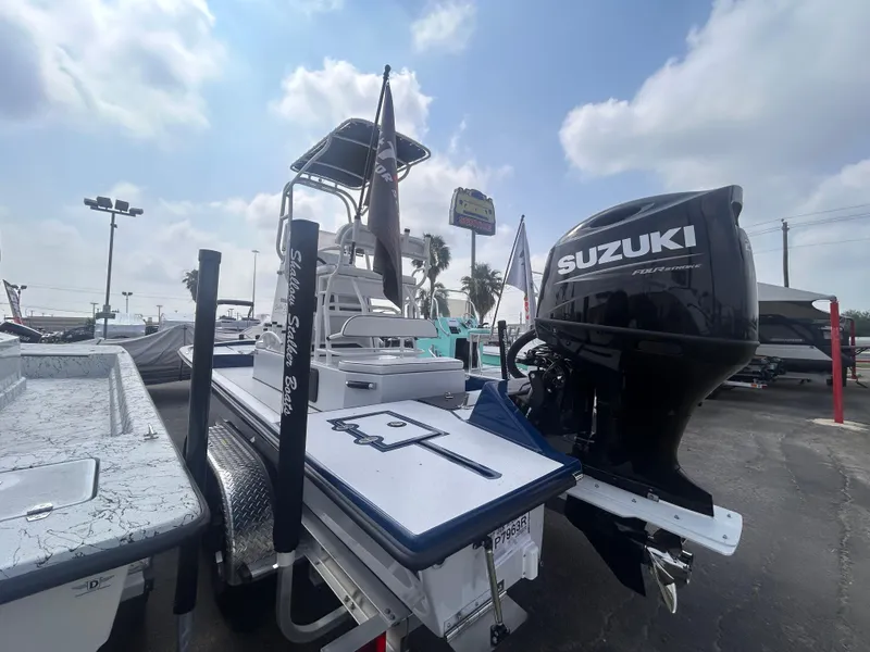 Slide: The Image of 2025 Shallow Stalker CAT211PRO boat with Suzuki engine, displayed outdoors under cloudy sky. - 5