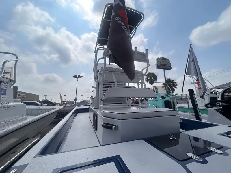 Slide: The Image of 2025 Shallow Stalker CAT211PRO boat with elevated seating, displayed outdoors under a cloudy sky. - 6