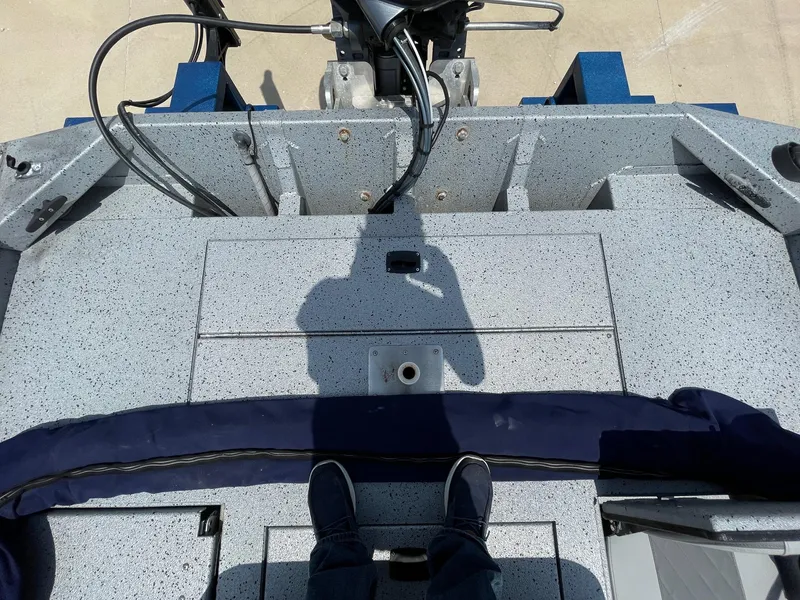 Slide: The Image of 2019 Xpress XP20CC boat deck with shadow and cables visible. - 16