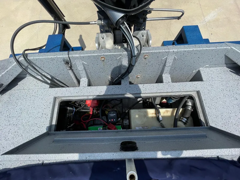 Slide: The Image of 2019 Xpress XP20CC boat interior showing wiring and components. - 17