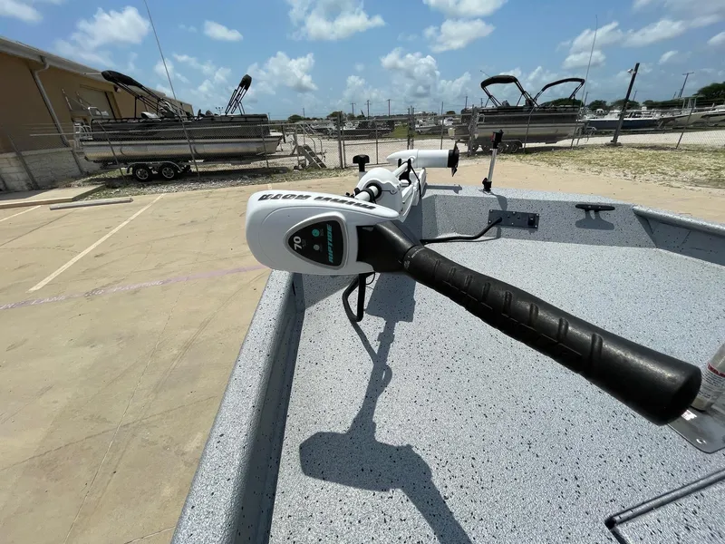 Slide: The Image of 2019 Xpress XP20CC boat with trolling motor in a parking lot. - 29