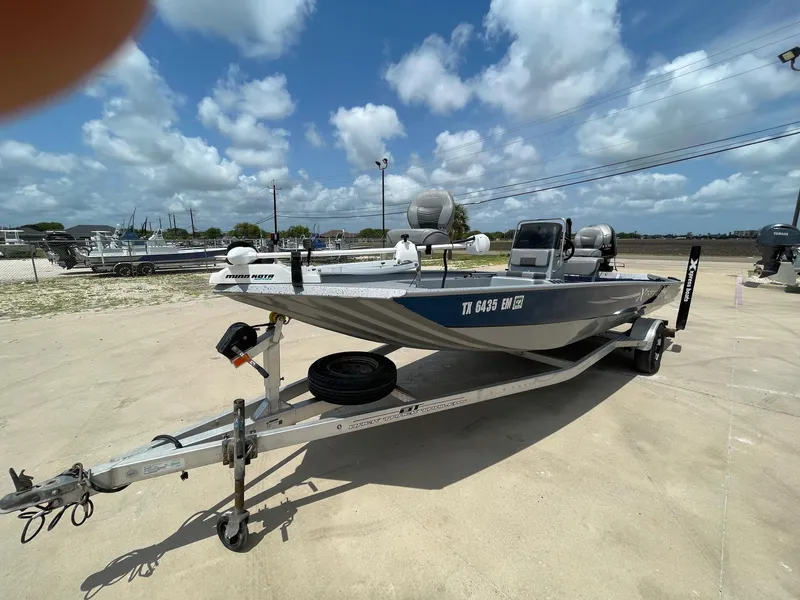 Slide: The Image of 2019 Xpress XP20CC boat on trailer under a cloudy sky. - 3