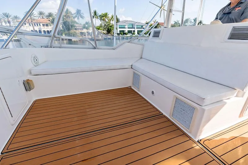 Slide: The Image of Luxurious 2001 Riviera 48 yacht interior with wooden flooring and comfortable seating. - 28