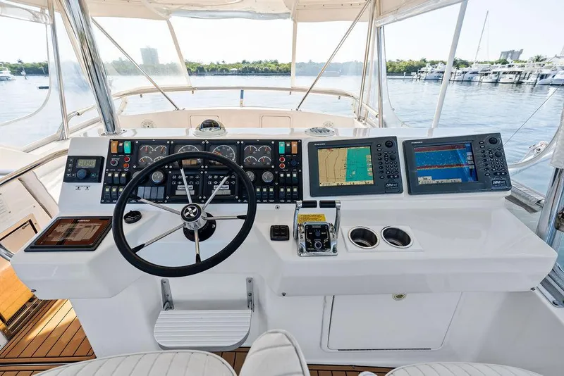 Slide: The Image of Simrad navigation display on 2001 Riviera 48 yacht dashboard, featuring advanced marine controls. - 31