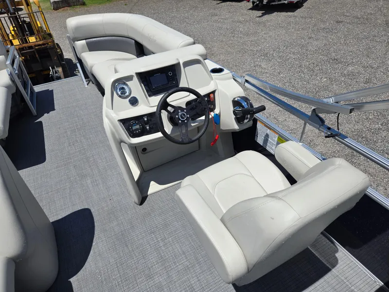 Slide: The Image of 2023 SunChaser Vista 18 LR boat interior with helm and seating. - 10