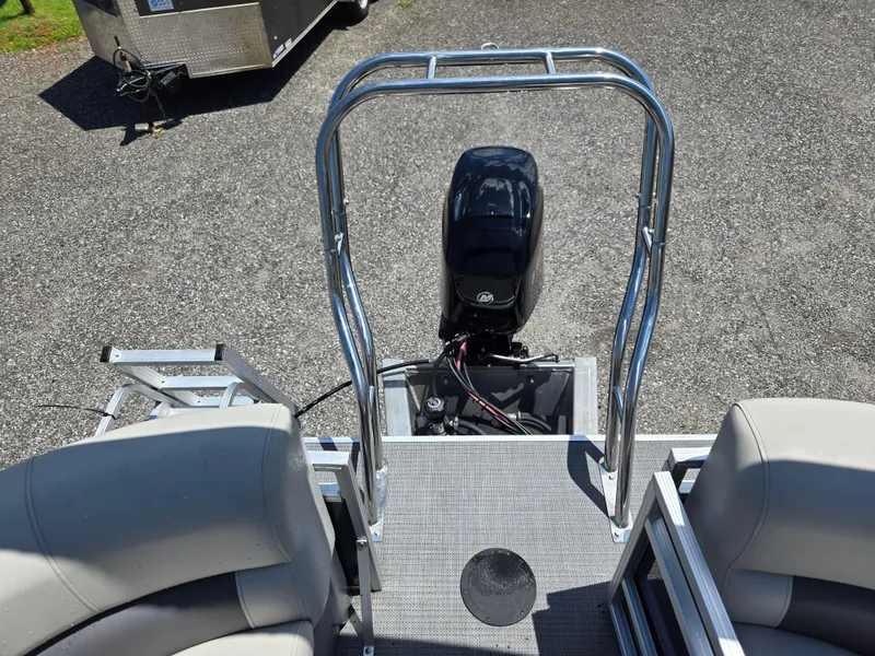 Slide: The Image of 2023 SunChaser Vista 18 LR boat with motor and seating, viewed from above. - 11