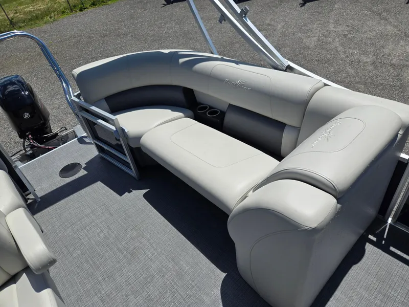Slide: The Image of 2023 SunChaser Vista 18 LR pontoon boat with gray seating and cup holders. - 13
