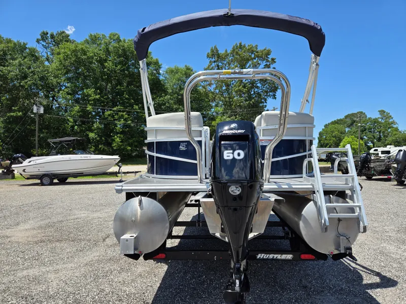Slide: The Image of 2023 SunChaser Vista 18 LR pontoon boat with 60 HP Mercury engine, parked outdoors. - 5