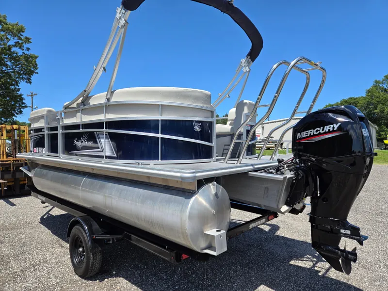 Slide: The Image of 2023 SunChaser Vista 18 LR pontoon boat with Mercury outboard motor on a trailer. - 6