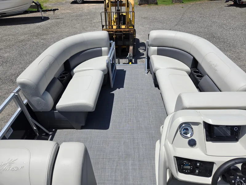 Slide: The Image of 2023 SunChaser Vista 18 LR pontoon boat with spacious seating and modern dashboard. - 9