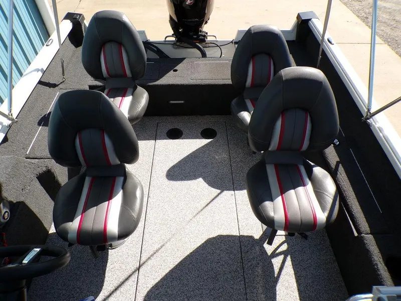 Slide: The Image of 2017 Ranger VS1780 boat interior with four gray seats and red accents. - 1