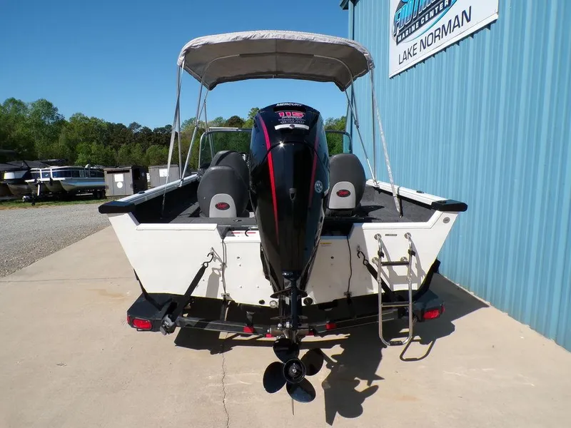 Slide: The Image of 2017 Ranger VS1780 boat with outboard motor and canopy, parked near Lake Norman. - 13