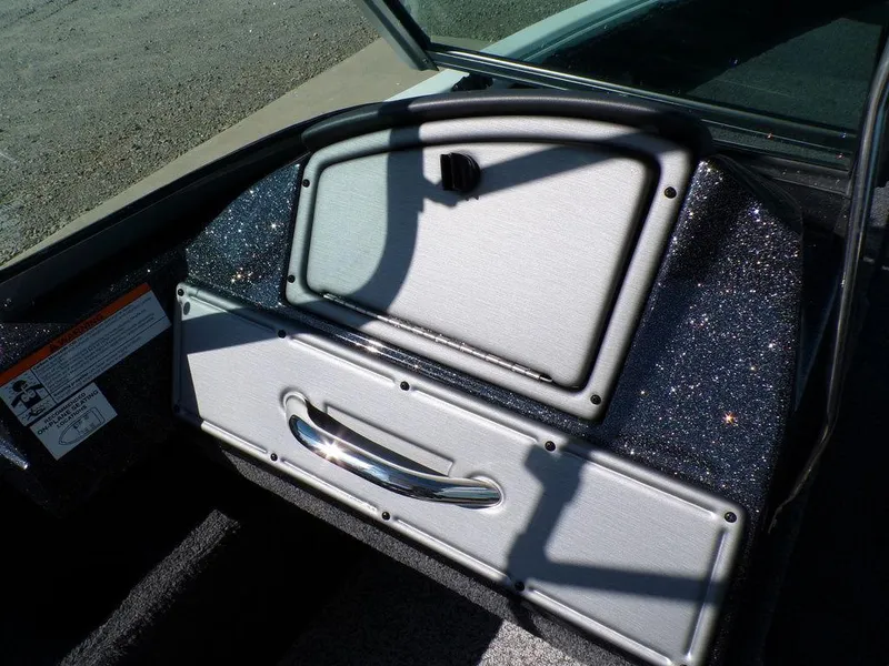 Slide: The Image of 2017 Ranger VS1780 boat dashboard with storage compartments and metallic finish. - 3