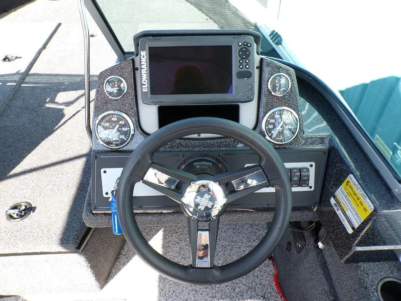 Slide: The Image of 2017 Ranger VS1780 boat dashboard with steering wheel and Lowrance fishfinder. - 5
