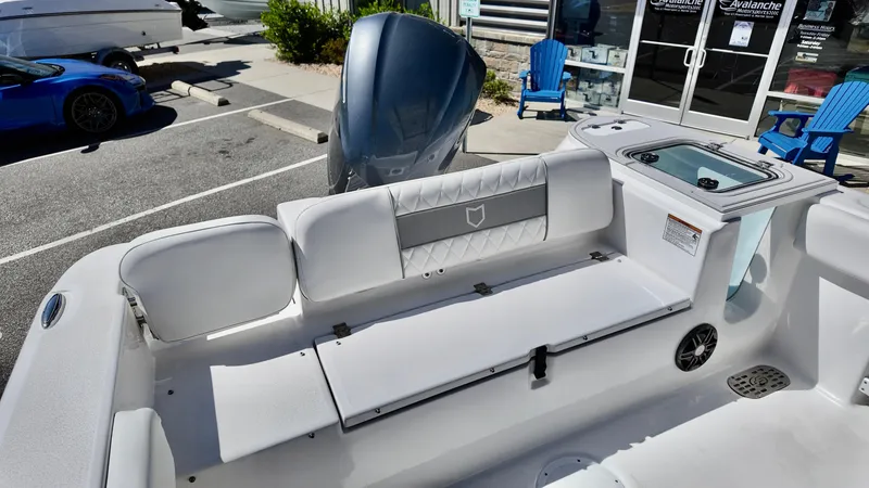 Slide: The Image of 2025 Sea Fox 248 Commander boat interior with seating and engine view. - 15