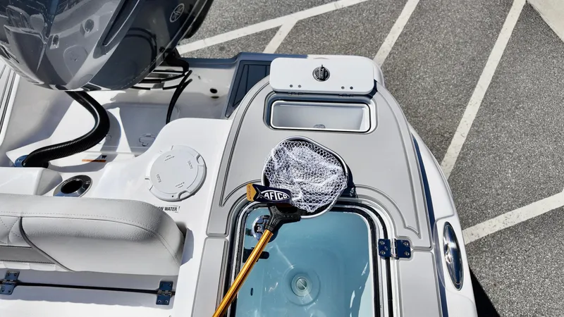 Slide: The Image of 2025 Sea Fox 248 Commander boat deck with fishing net and livewell. - 16