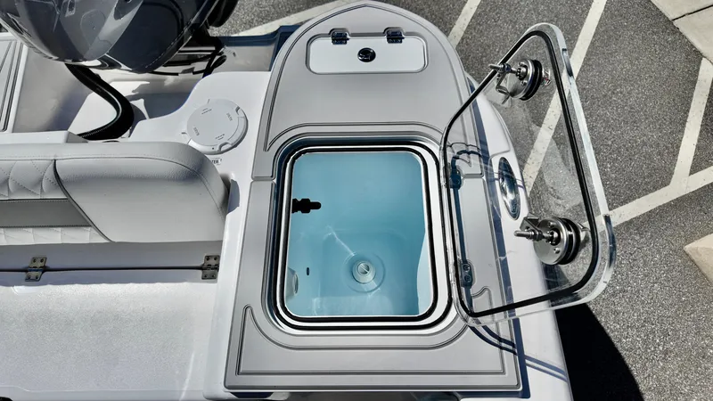 Slide: The Image of 2025 Sea Fox 248 Commander boat with open livewell and seating area. - 17