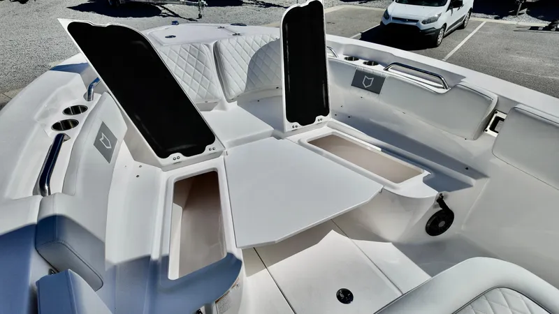 Slide: The Image of 2025 Sea Fox 248 Commander boat interior with open storage compartments and seating. - 20