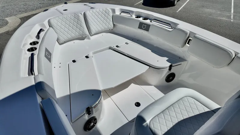 Slide: The Image of 2025 Sea Fox 248 Commander boat interior with cushioned seating and storage compartments. - 21