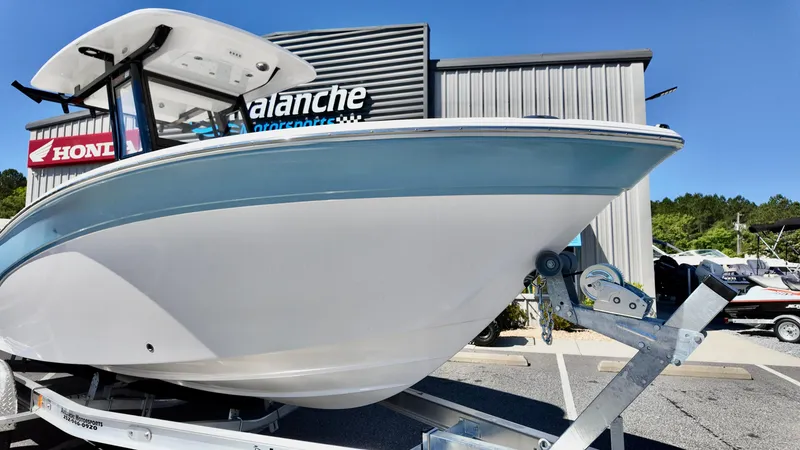 Slide: The Image of 2025 Sea Fox 248 Commander boat on trailer outside dealership. - 4