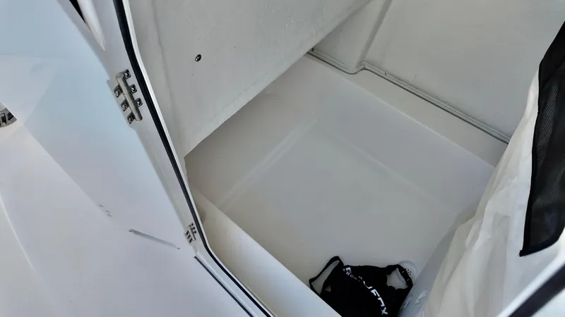 Slide: The Image of Storage compartment inside 2025 Sea Fox 248 Commander boat, featuring clean white interior. - 8