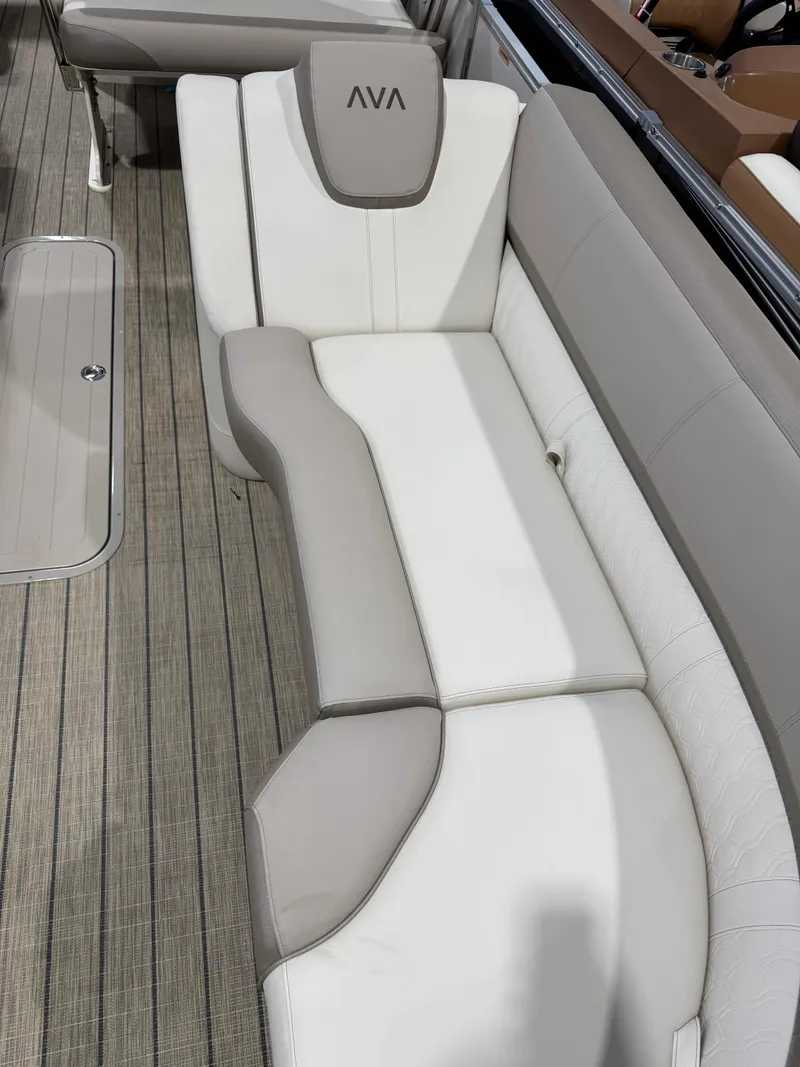 Slide: The Image of 2025 Avalon 2585 25 Catalina ENT boat interior with beige and white seating. - 6