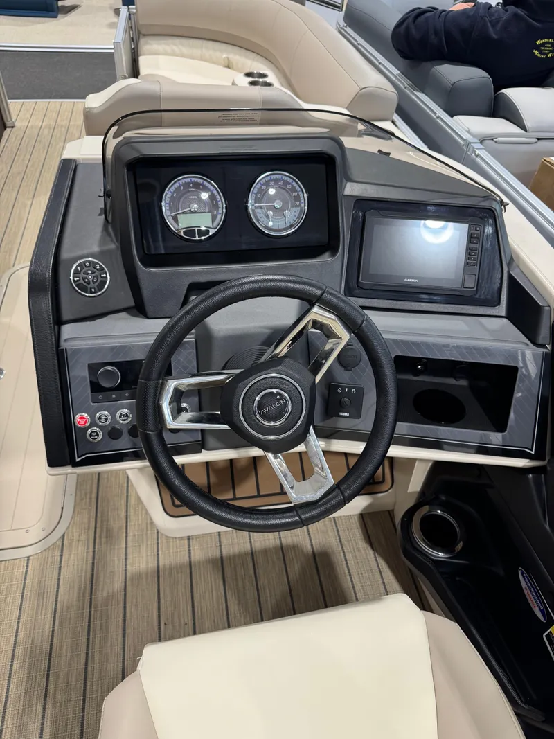 Slide: The Image of 2025 Avalon 2585 25 Catalina ENT boat dashboard with steering wheel and gauges. - 8