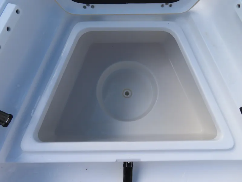 Slide: The Image of 2023 Sportsman Heritage 231 Center Console livewell, open and empty. - 12